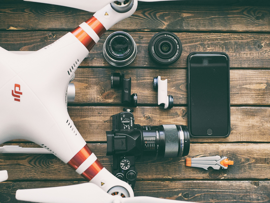 A drone and other photography equipment on a table